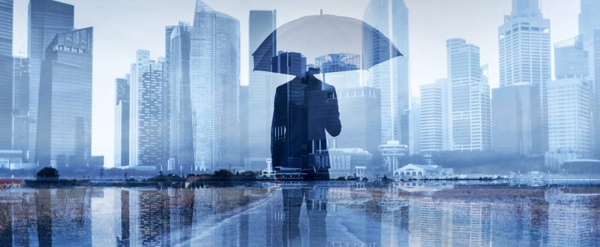 insurance concept, risk in business, businessman with umbrella double exposure